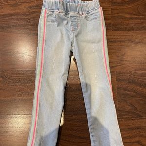 Distressed jean legging style.